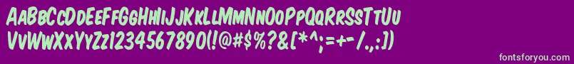 KomikaTitleKaps Font – Green Fonts on Purple Background