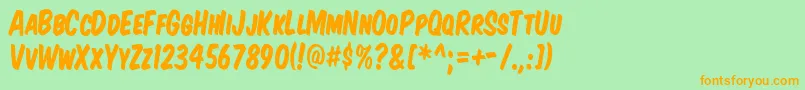 KomikaTitleKaps Font – Orange Fonts on Green Background