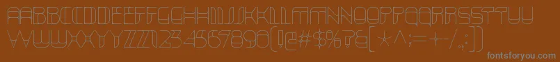 KraitHollow-fontti – harmaat kirjasimet ruskealla taustalla