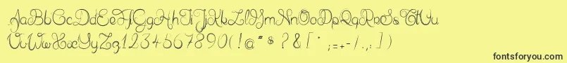 フォントDelphineetmathiasscript – 黒い文字の黄色い背景