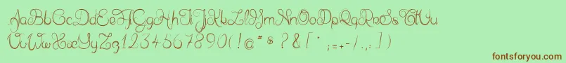 フォントDelphineetmathiasscript – 緑の背景に茶色のフォント