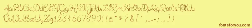 Delphineetmathiasscript-fontti – ruskeat fontit keltaisella taustalla