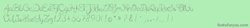 フォントDelphineetmathiasscript – 緑の背景に灰色の文字