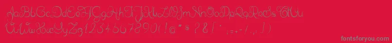 フォントDelphineetmathiasscript – 赤い背景に灰色の文字