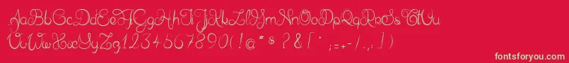 フォントDelphineetmathiasscript – 赤い背景に緑の文字