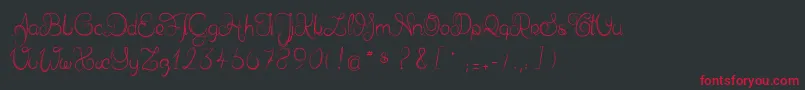フォントDelphineetmathiasscript – 黒い背景に赤い文字