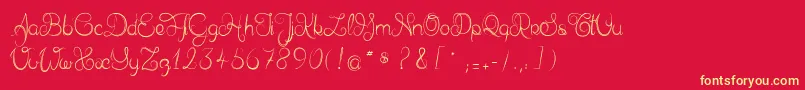 Delphineetmathiasscript-Schriftart – Gelbe Schriften auf rotem Hintergrund