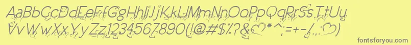 DreamLoveValentineLightItalic-fontti – harmaat kirjasimet keltaisella taustalla
