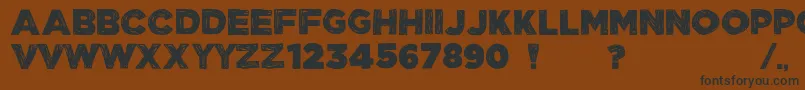 ManhattanHandBoldAllCaps-fontti – mustat fontit ruskealla taustalla