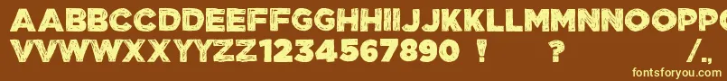 ManhattanHandBoldAllCaps-fontti – keltaiset fontit ruskealla taustalla