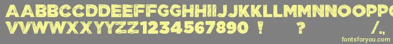 フォントManhattanHandBoldAllCaps – 黄色のフォント、灰色の背景