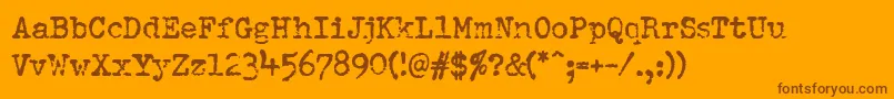 Pfdumboldtypetwo-Schriftart – Braune Schriften auf orangefarbenem Hintergrund