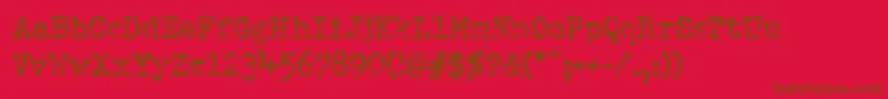 Pfdumboldtypetwo-Schriftart – Braune Schriften auf rotem Hintergrund