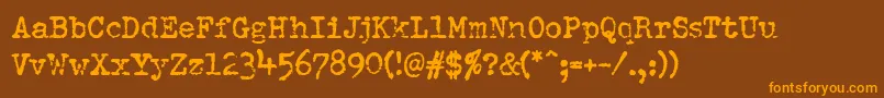 Więcej informacji o czcionce Pfdumboldtypetwo Czcionka Pfdumboldtypetwo – pomarańczowe czcionki na brązowym tle