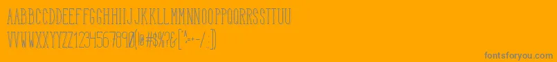 HbmSerenityTrend-Schriftart – Graue Schriften auf orangefarbenem Hintergrund