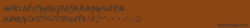 フォントKristi – 黒い文字が茶色の背景にあります