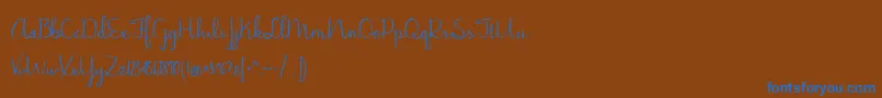 フォントJasmineReminiscentse – 茶色の背景に青い文字