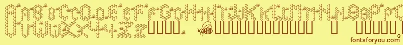 フォントBzzzbee – 茶色の文字が黄色の背景にあります。