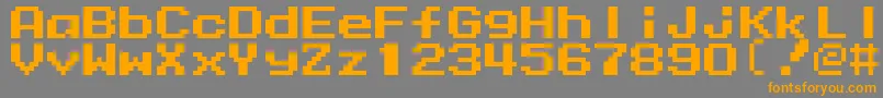 フォントMmrock9 – オレンジの文字は灰色の背景にあります。