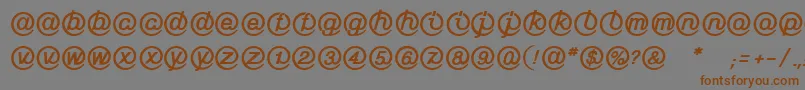 Więcej informacji o czcionce LinotypeMailboxHeavy Czcionka LinotypeMailboxHeavy – brązowe czcionki na szarym tle