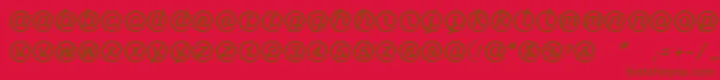 LinotypeMailboxHeavy-Schriftart – Braune Schriften auf rotem Hintergrund