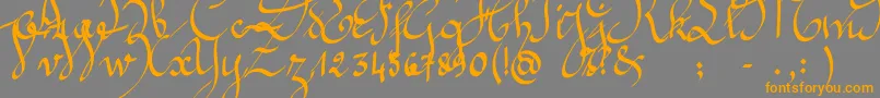 フォントJeannette – オレンジの文字は灰色の背景にあります。
