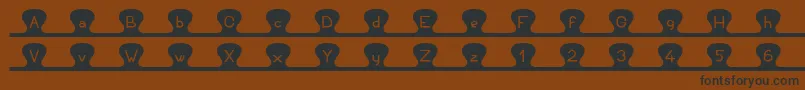 Unzipme Font – Black Fonts on Brown Background