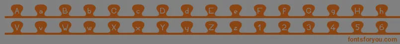 Unzipme Font – Brown Fonts on Gray Background