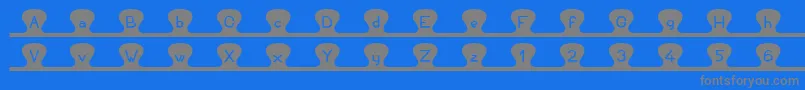 Unzipme Font – Gray Fonts on Blue Background