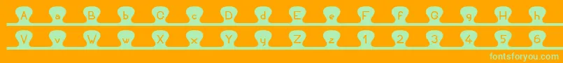 Unzipme Font – Green Fonts on Orange Background