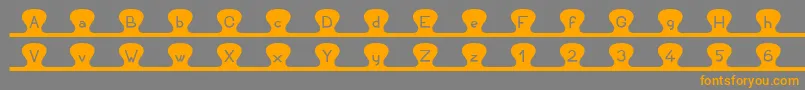Unzipme Font – Orange Fonts on Gray Background