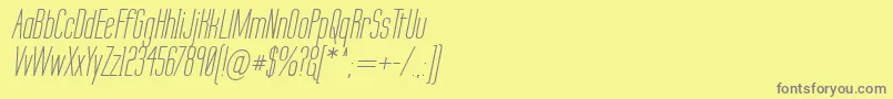LabtopSecundoItalic-fontti – harmaat kirjasimet keltaisella taustalla