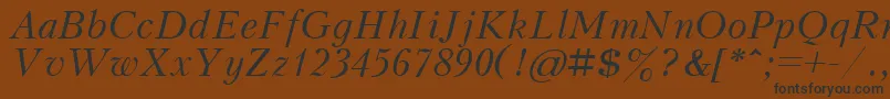 Czcionka KudrashovcttItalic – czarne czcionki na brązowym tle