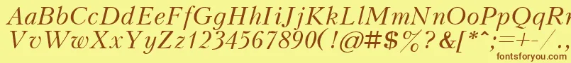 フォントKudrashovcttItalic – 茶色の文字が黄色の背景にあります。