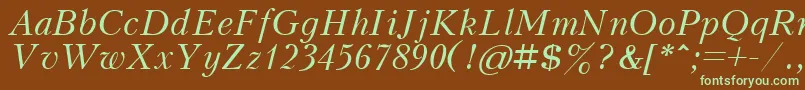 フォントKudrashovcttItalic – 緑色の文字が茶色の背景にあります。