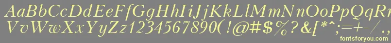 KudrashovcttItalic-Schriftart – Gelbe Schriften auf grauem Hintergrund