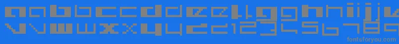 フォントRoyalsimp – 青い背景に灰色の文字
