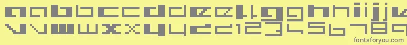 Royalsimp-fontti – harmaat kirjasimet keltaisella taustalla