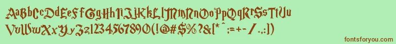 Magicschoolone-Schriftart – Braune Schriften auf grünem Hintergrund