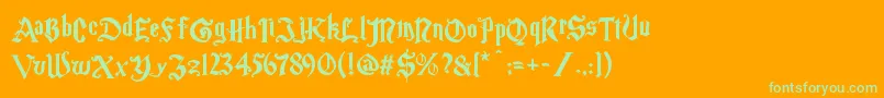Magicschoolone-Schriftart – Grüne Schriften auf orangefarbenem Hintergrund