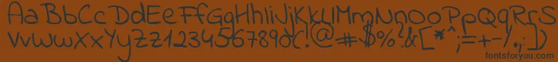 Indieflower Font – Black Fonts on Brown Background