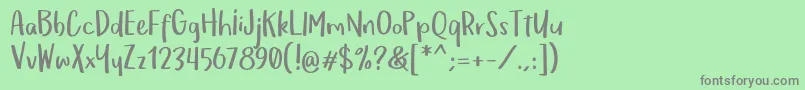 OmTeloletOm Font – Gray Fonts on Green Background