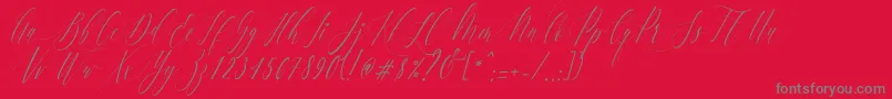 フォントCharlotteCalligraphySlantR1 – 赤い背景に灰色の文字