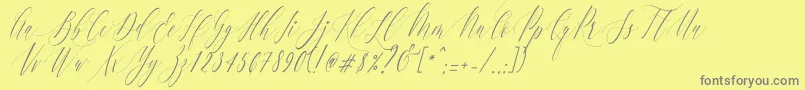 CharlotteCalligraphySlantR1-Schriftart – Graue Schriften auf gelbem Hintergrund