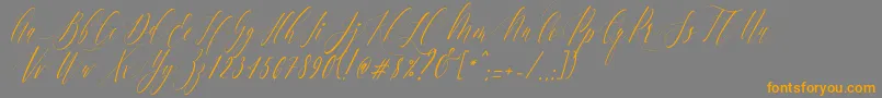 Czcionka CharlotteCalligraphySlantR1 – pomarańczowe czcionki na szarym tle