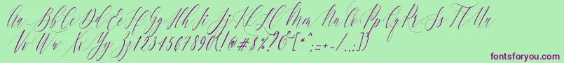 Czcionka CharlotteCalligraphySlantR1 – fioletowe czcionki na zielonym tle