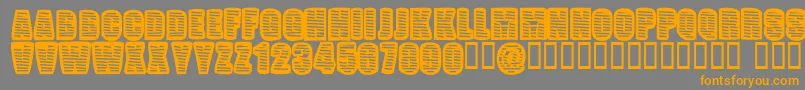 フォントPopWillEatItself – オレンジの文字は灰色の背景にあります。