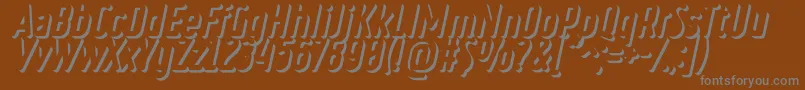 RulerVolumeOuter-Schriftart – Graue Schriften auf braunem Hintergrund