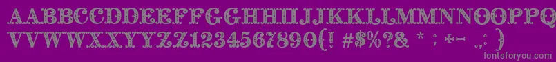 BaroccoInitial-fontti – harmaat kirjasimet violetilla taustalla
