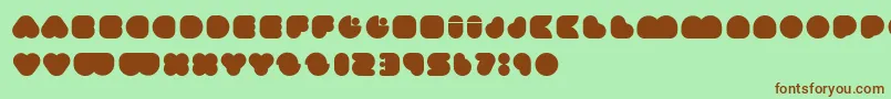 Happyloverstown.EuUmmagomma Font – Brown Fonts on Green Background